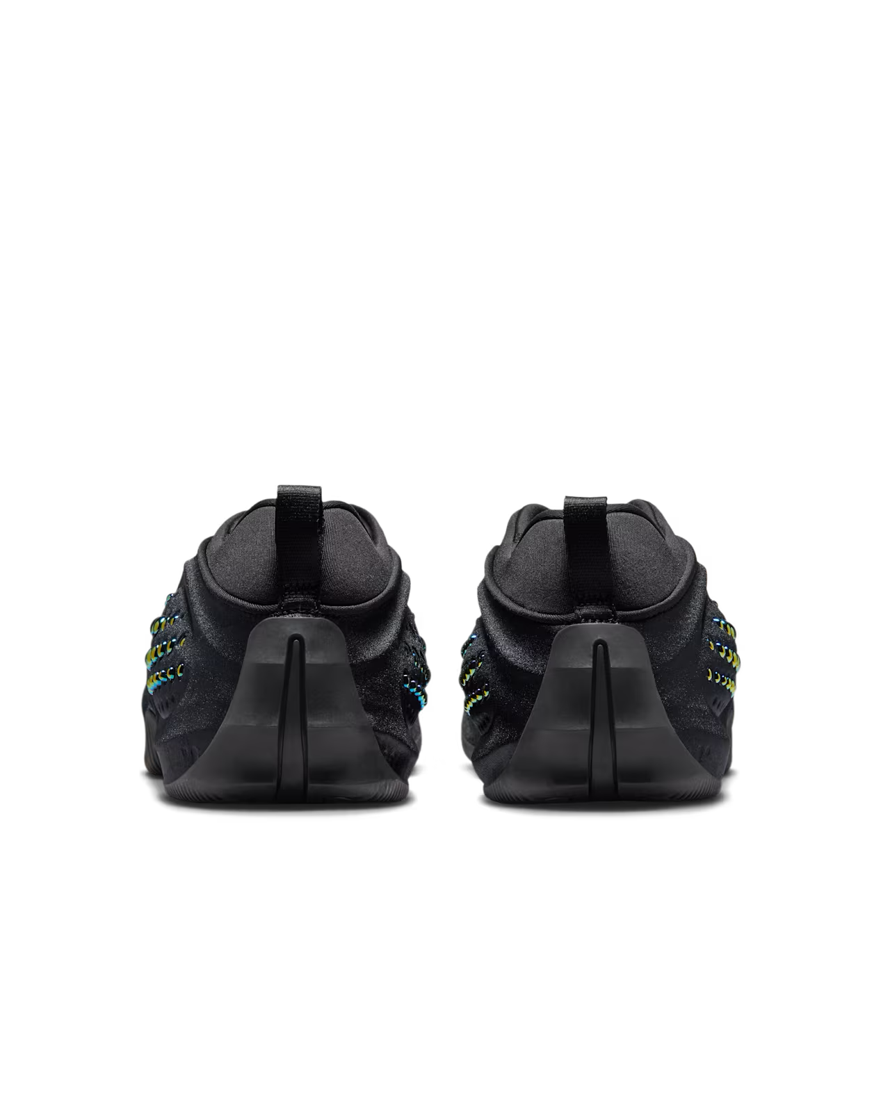 A pair of black Machina Wearable Technology First Sight Shadow Low athletic shoes in Black and Metallic Dark Grey shown from the back, featuring textured soles and striking blue and yellow stitching accents on the sides—an eye-catching addition to any women’s lifestyle footwear collection.