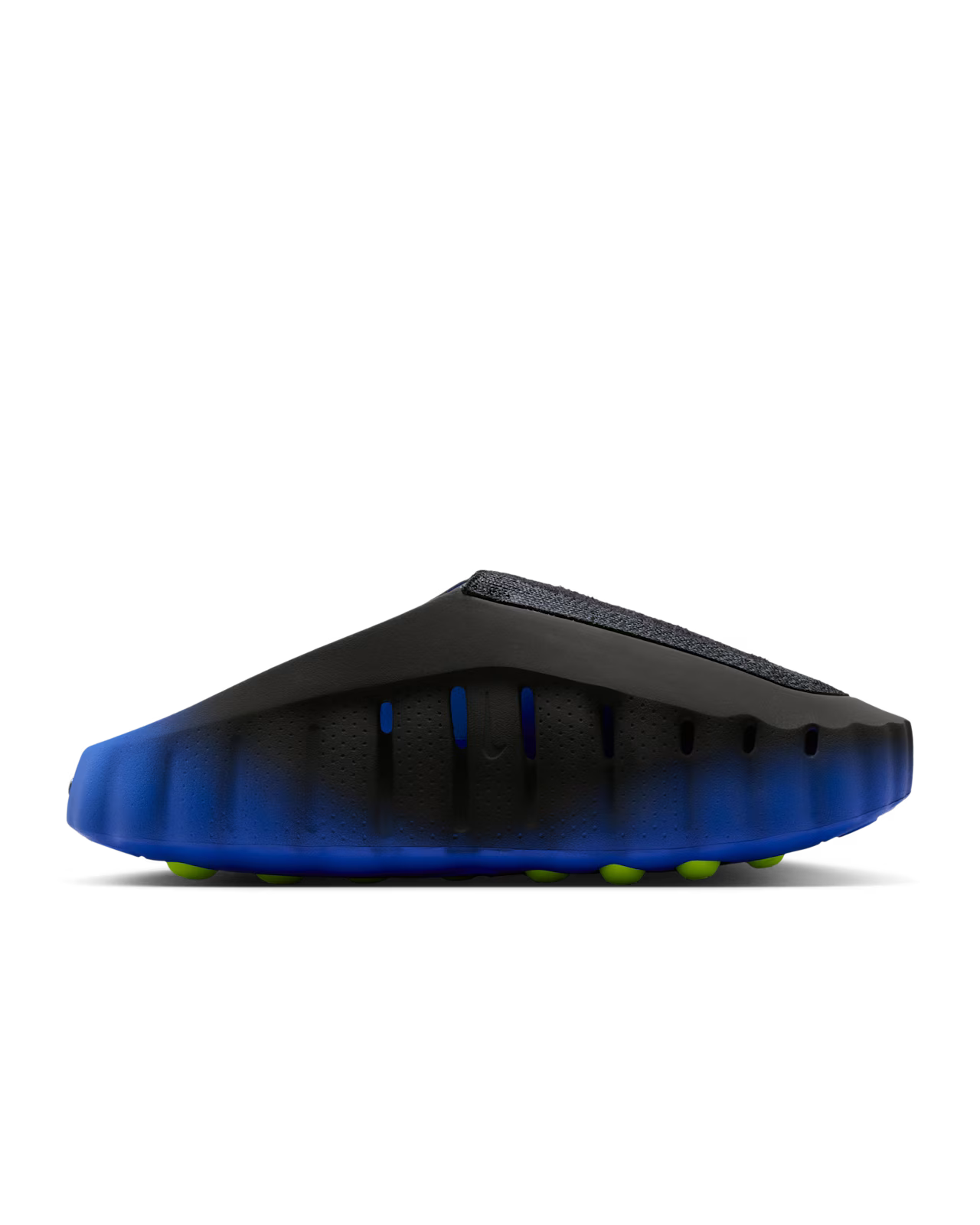 The Machina Wearable Technology Mind 001 Flyknit Hyper Royal is a black slip-on shoe featuring a mesh upper and a thick, sculpted sole that fades from black to blue with green accents on the bottom, shown in side profile on a white background.