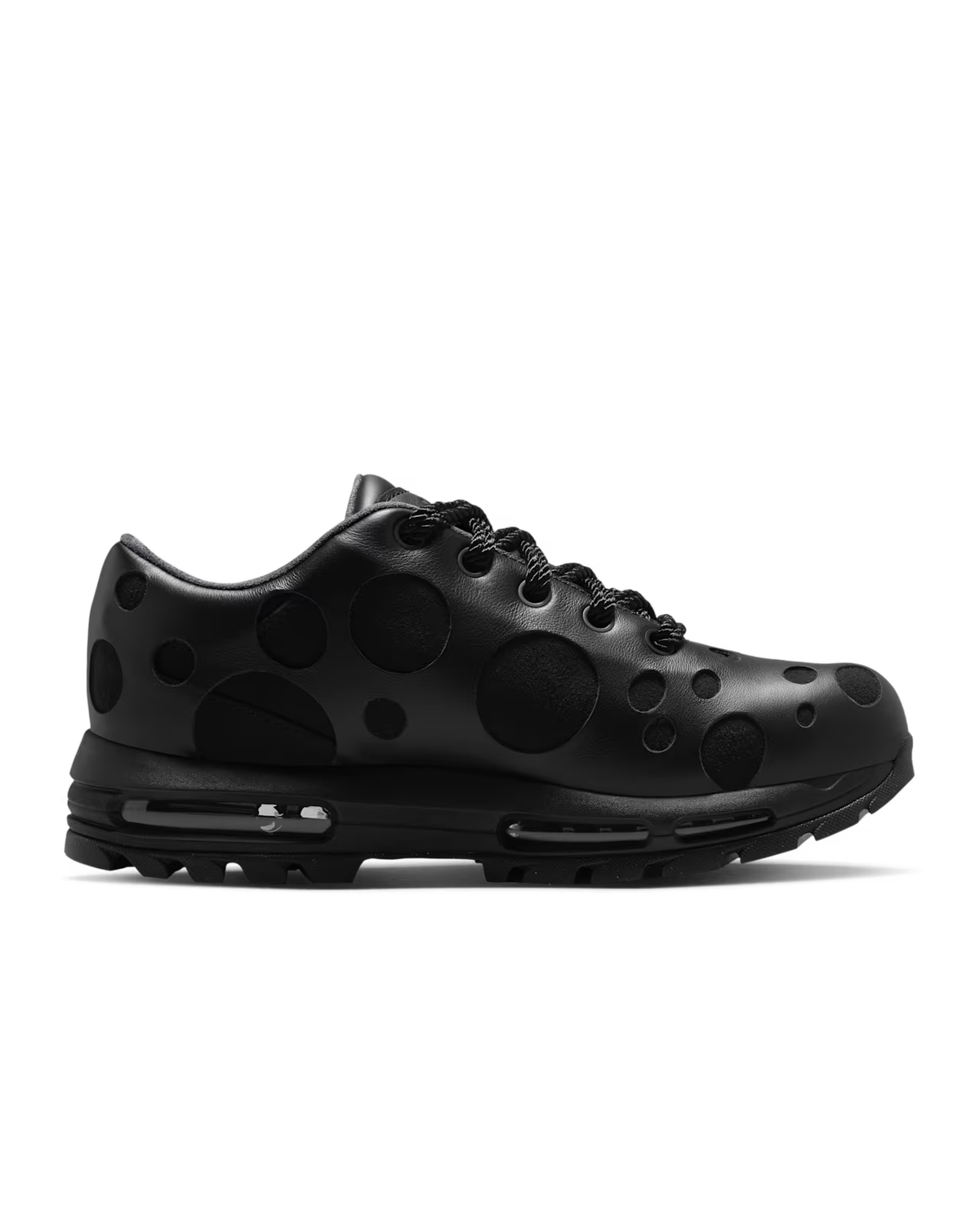 Introducing the Air Max Goadome Low [ Black ] by Machina Wearable Technology—a black sneaker inspired by the classic Nike Air Max Goadome, showcasing prominent raised black polka dots on the upper, black laces, and a sturdy black sole with visible Air cushioning for superior comfort.
