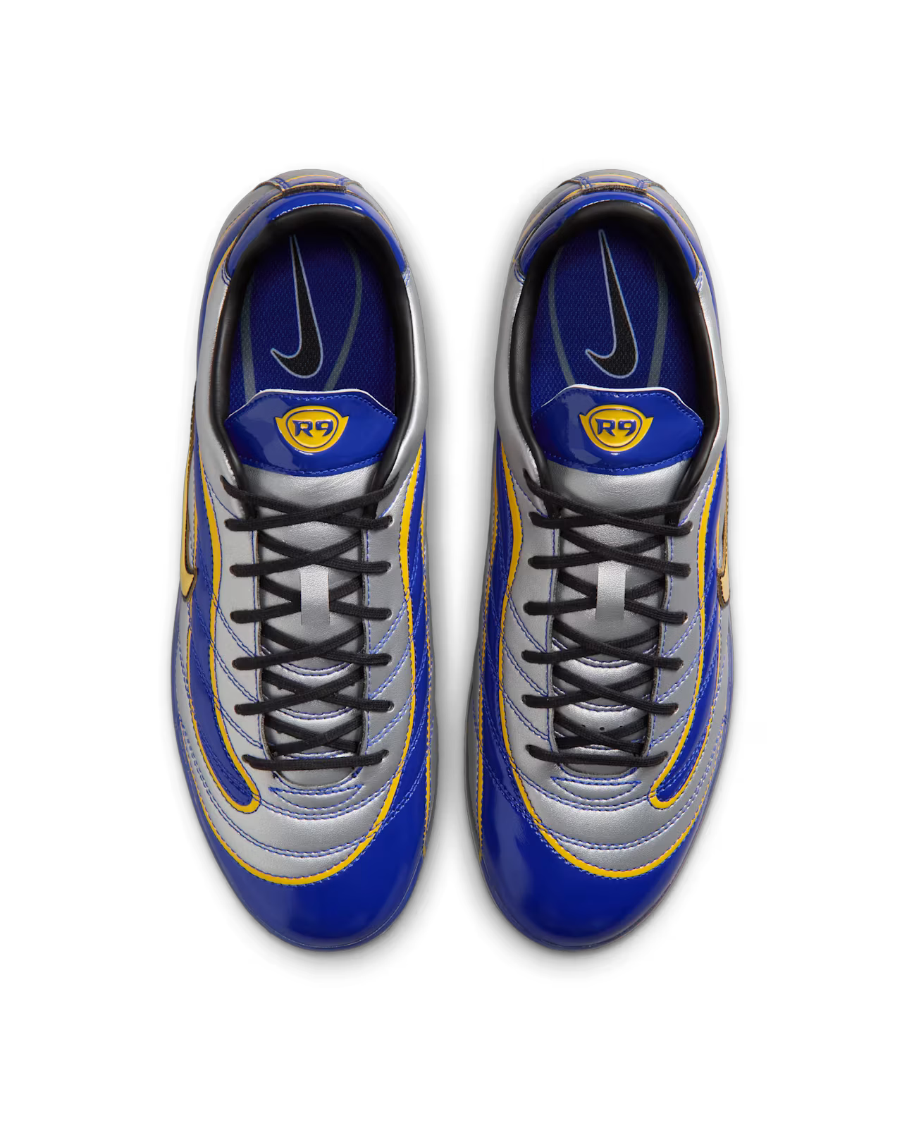 Top view of a pair of blue, silver, and yellow Machina Wearable Technology Cryoshot Mercurial Vapor R9 OG / PACOTE soccer cleats with black laces, blue insoles, and an R9 logo on each tongue—an online exclusive inspired by the iconic CRYOSHOT R9 line.