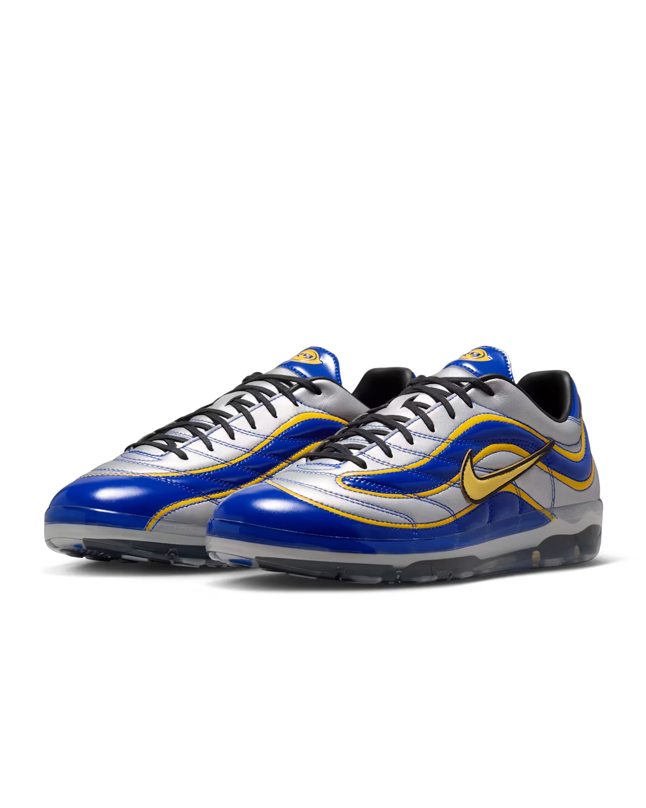 A pair of Machina Wearable Technology Cryoshot Mercurial Vapor R9 OG / PACOTE sneakers featuring metallic silver, blue, and gold accents with a distinctive wavy design and transparent soles, displayed on a white background—this online exclusive edition brings cutting-edge style to your collection.