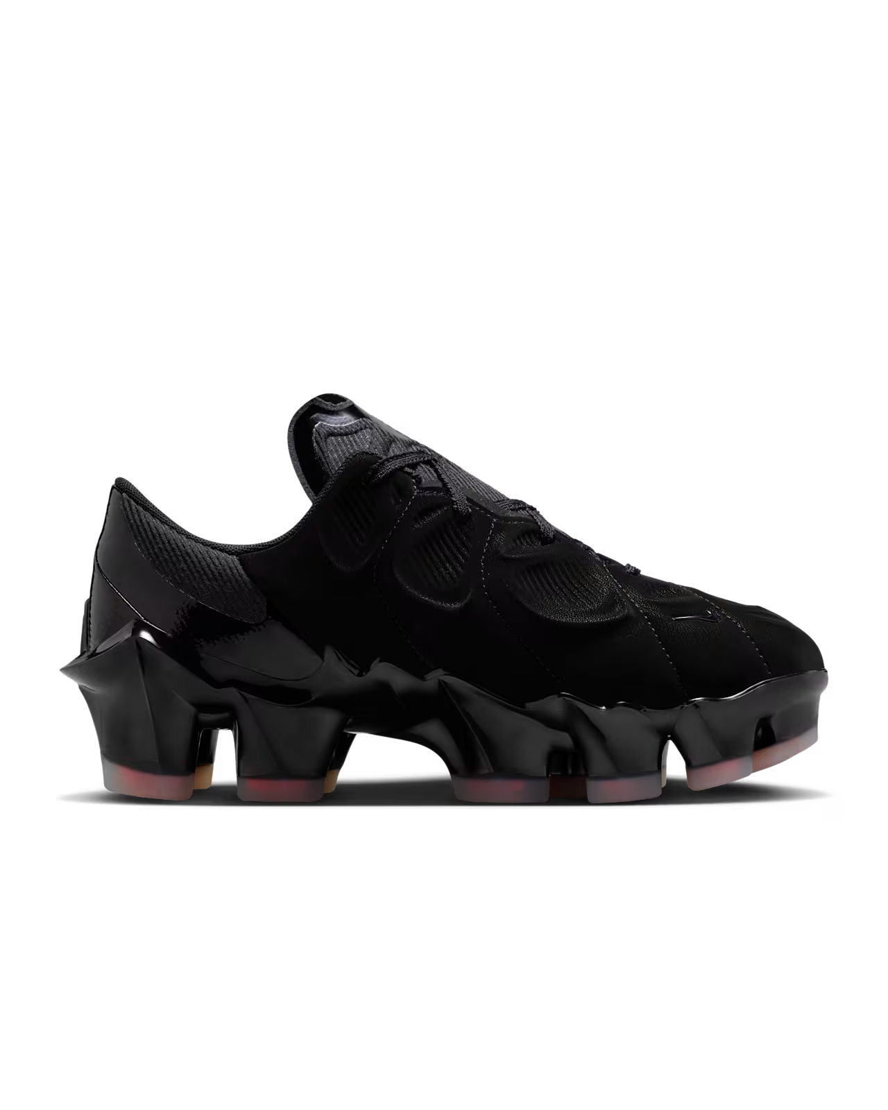 The Machina Wearable Technology Nike First Sight Mirage Black and Flash Crimson features a futuristic design with mesh and suede uppers, a glossy sculpted segmented sole, cleat-inspired platform details, and distinctive angular heel and toe shapes.