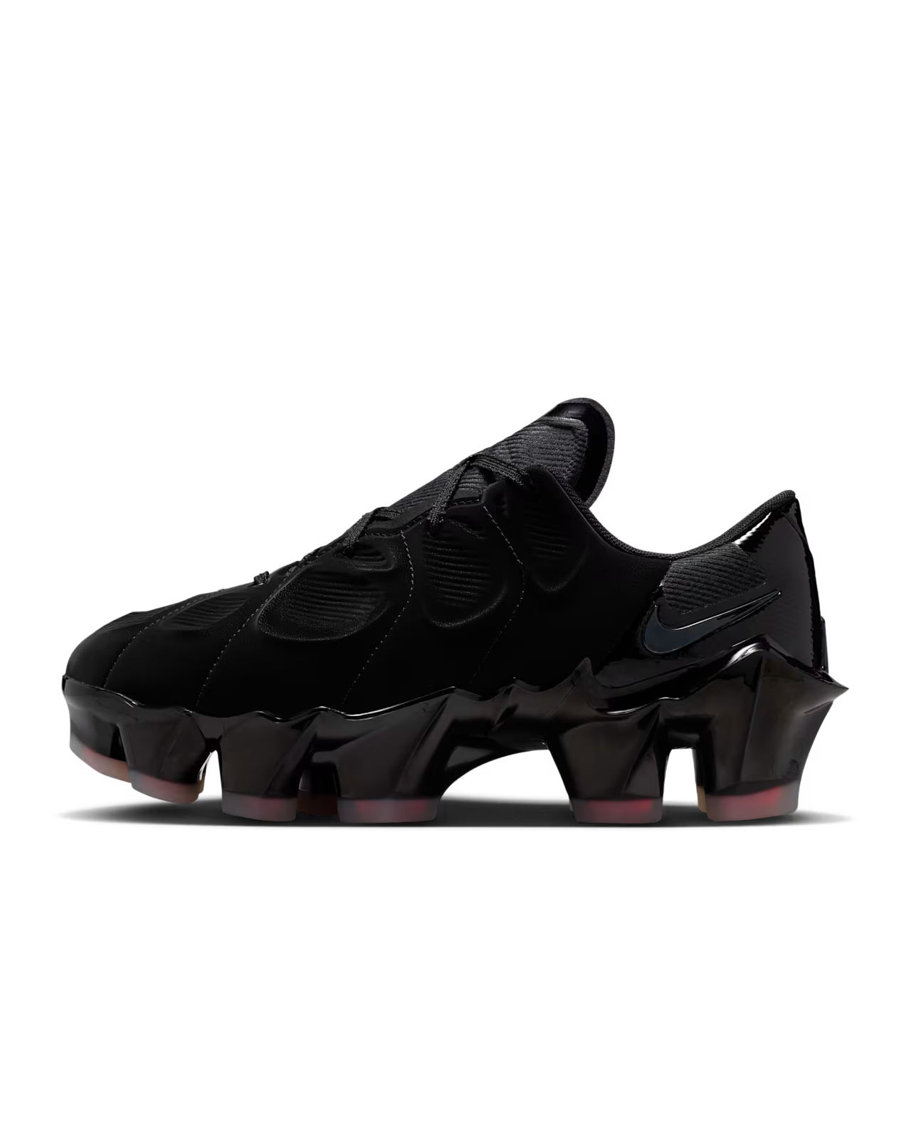A Machina Wearable Technology Nike First Sight Mirage Black and Flash Crimson sneaker features a jagged, cleat-inspired sole and dark swoosh, shown in side view on a white background.