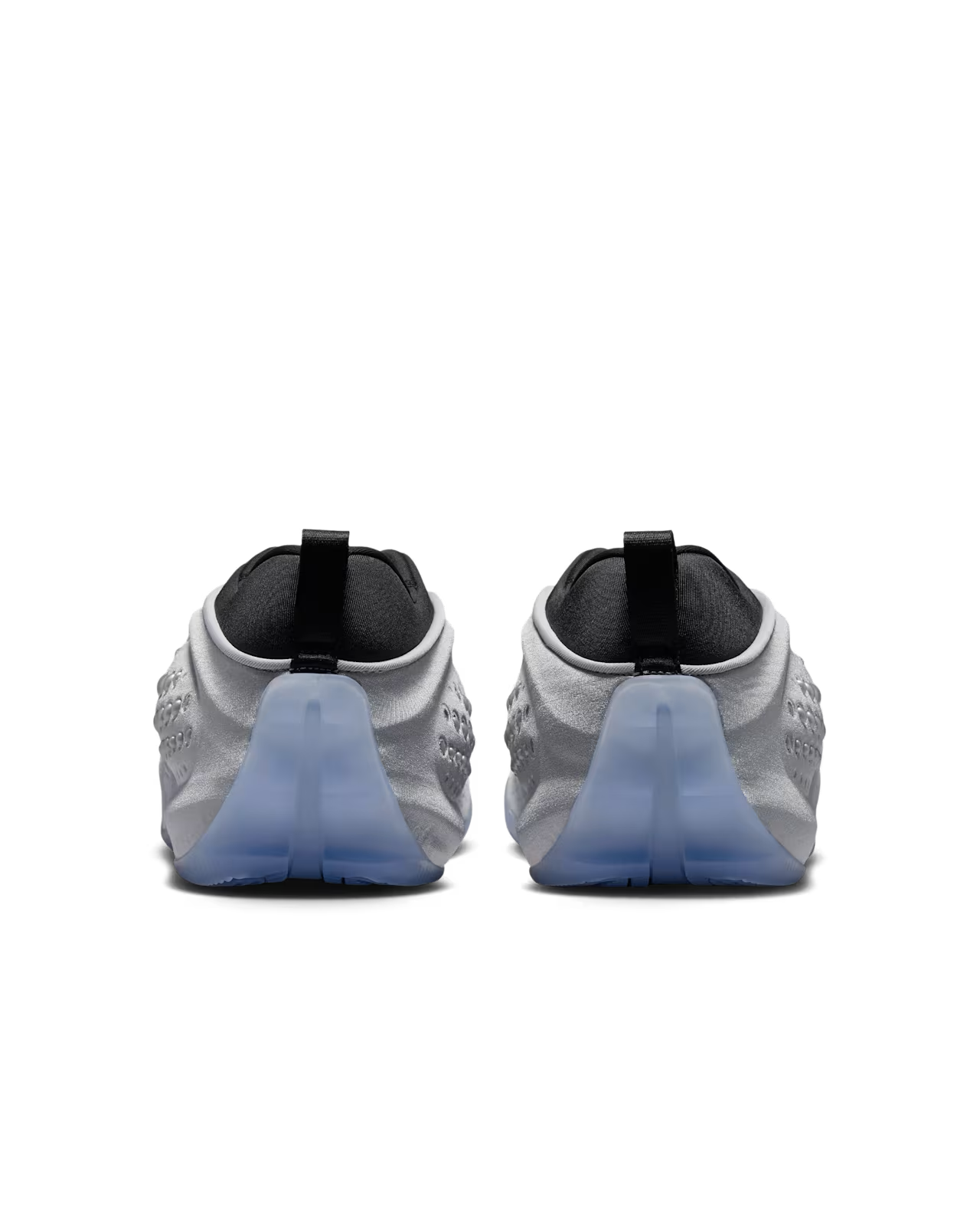 A pair of gray athletic shoes viewed from the back, featuring black heel tabs and translucent blue soles against a white background, these Machina Wearable Technology First Sight Shadow Low sneakers in Metallic Silver and Black perfectly embody women’s lifestyle footwear with their modern silhouette and subtle metallic silver accents.