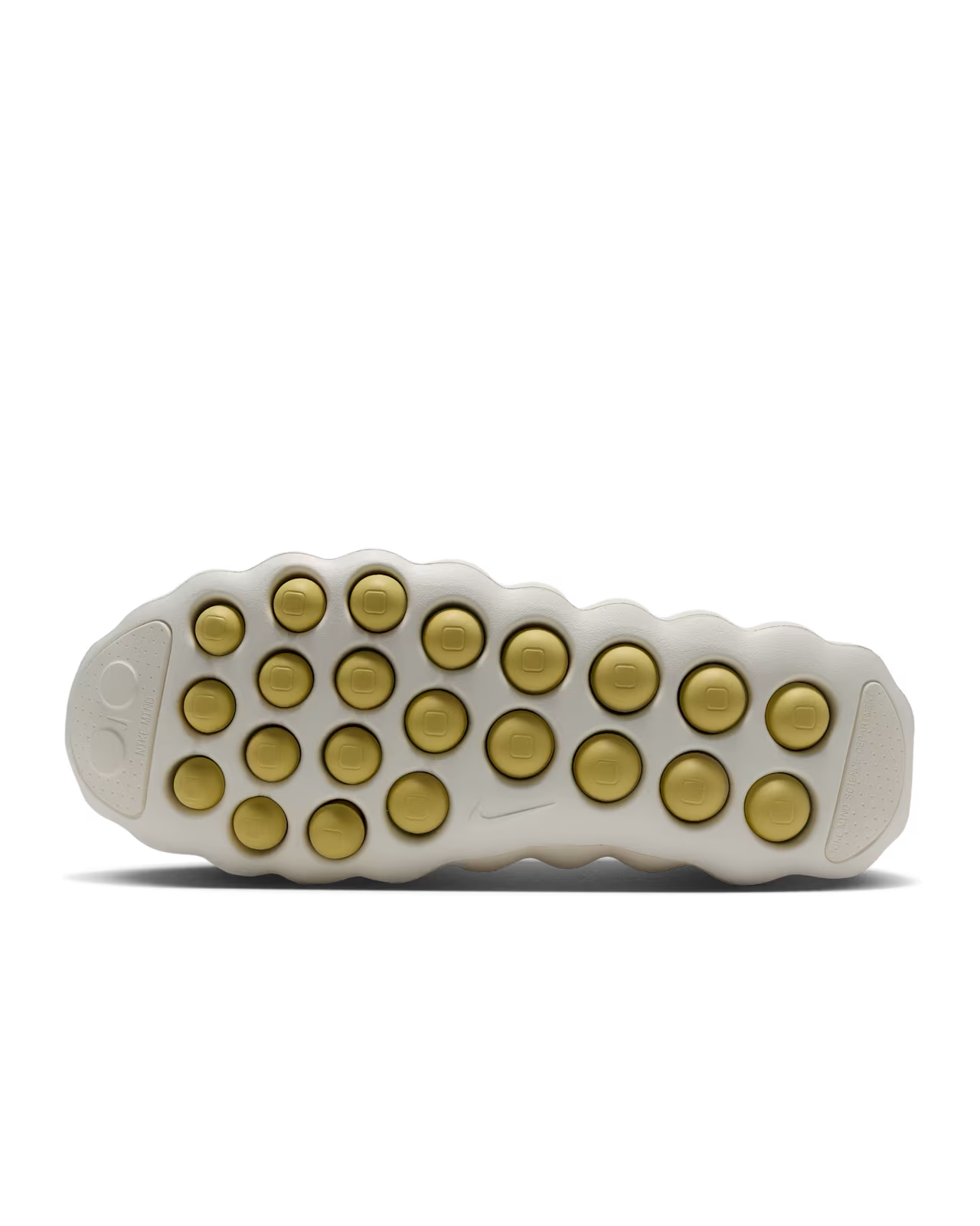 The white sole of the Machina Wearable Technology Mind 002 Light Bone and Saturn Gold sneaker features multiple round, gold-colored rubber grips arranged in a grid pattern.