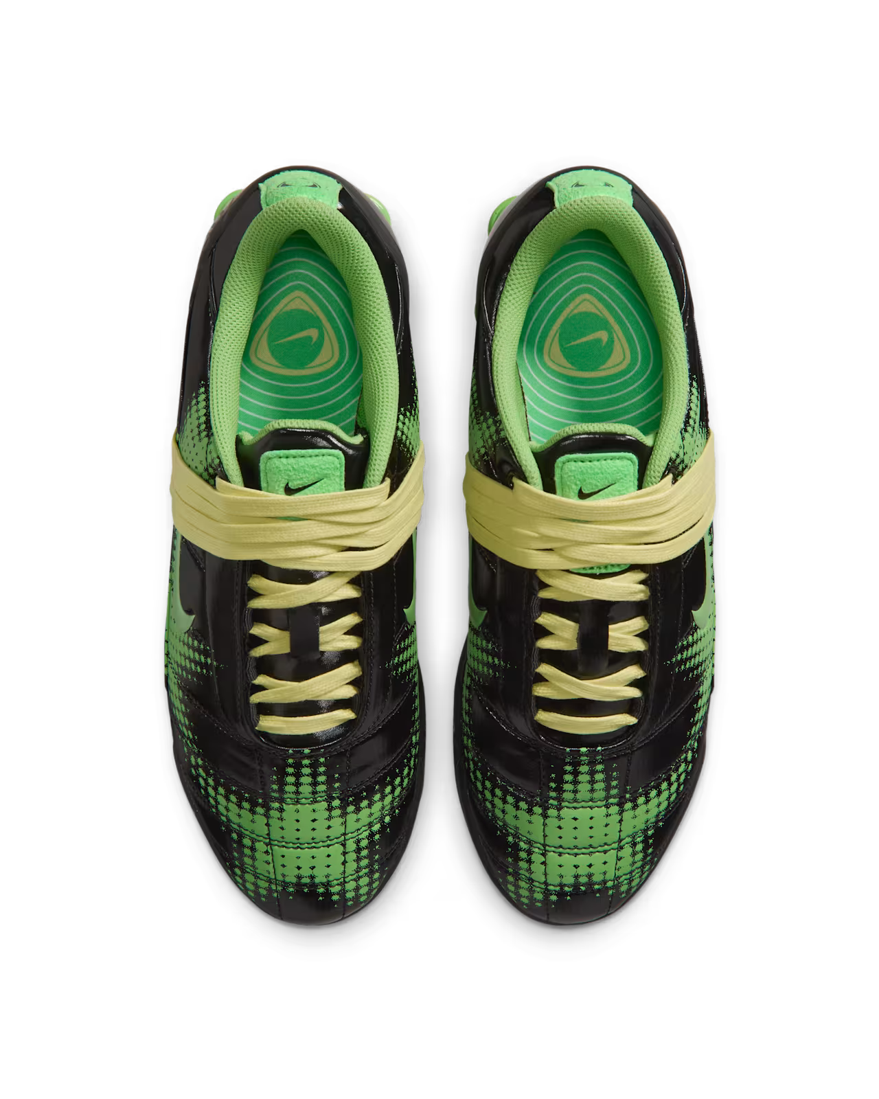 A pair of Machina Wearable Technology Total 90 Shox Magia Black and Yellow Diamond sneakers, inspired by the iconic football shoes, featuring black and green diamond-patterned uppers, neon green interiors, and yellow laces, viewed from above on a white background.