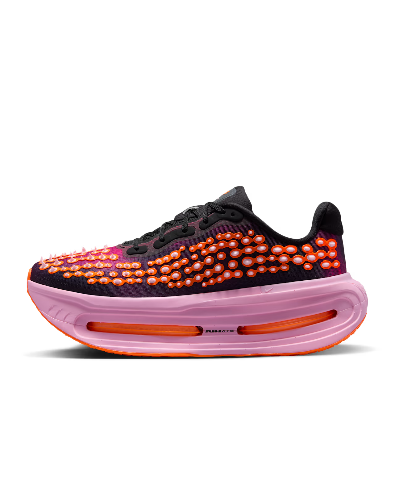 The Machina Wearable Technology Nike Vomero Premium “Otaku Approved” is a black and purple sneaker accented with bright orange and pink raised dots, an eye-catching thick pink sole, and vibrant orange details. Inspired by the iconic Nike Vomero Premium, this pair delivers bold styling atop a ZoomX platform—perfect for those seeking maximum-cushion comfort in their running shoes without compromising on standout design.