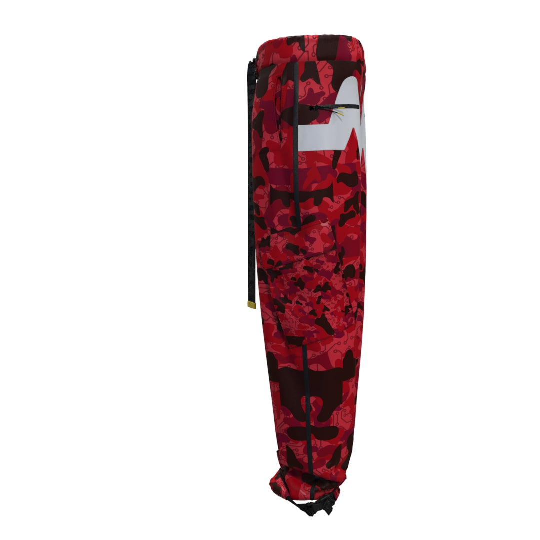 Side view of the Diablo Cargo Pants by Machina - Wearable Technology in a striking red camo design with an abstract pattern. Featuring a black drawstring waist and white accents, these sporty sweatpants are gathered at the ankles and crafted from recycled fabric for a modern touch.