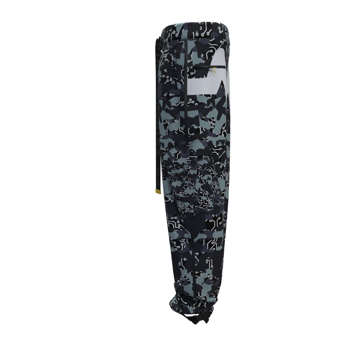 Side view of black and gray camouflage-patterned jogger pants with an elastic waistband and drawstring. Designed by Machina - Wearable Technology, these joggers are crafted from recycled fabric, featuring abstract designs for a modern, sporty appearance reminiscent of the sleek Black Mamba Cargo Pants Woman.