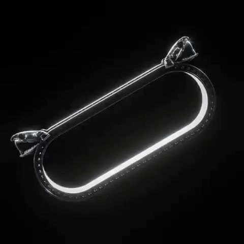 The Schism Serpent Two Finger Ring by Machina - Wearable Technology features a glowing oval LED encased in a slim metallic frame with dual attachments, slowly rotating against a black background.