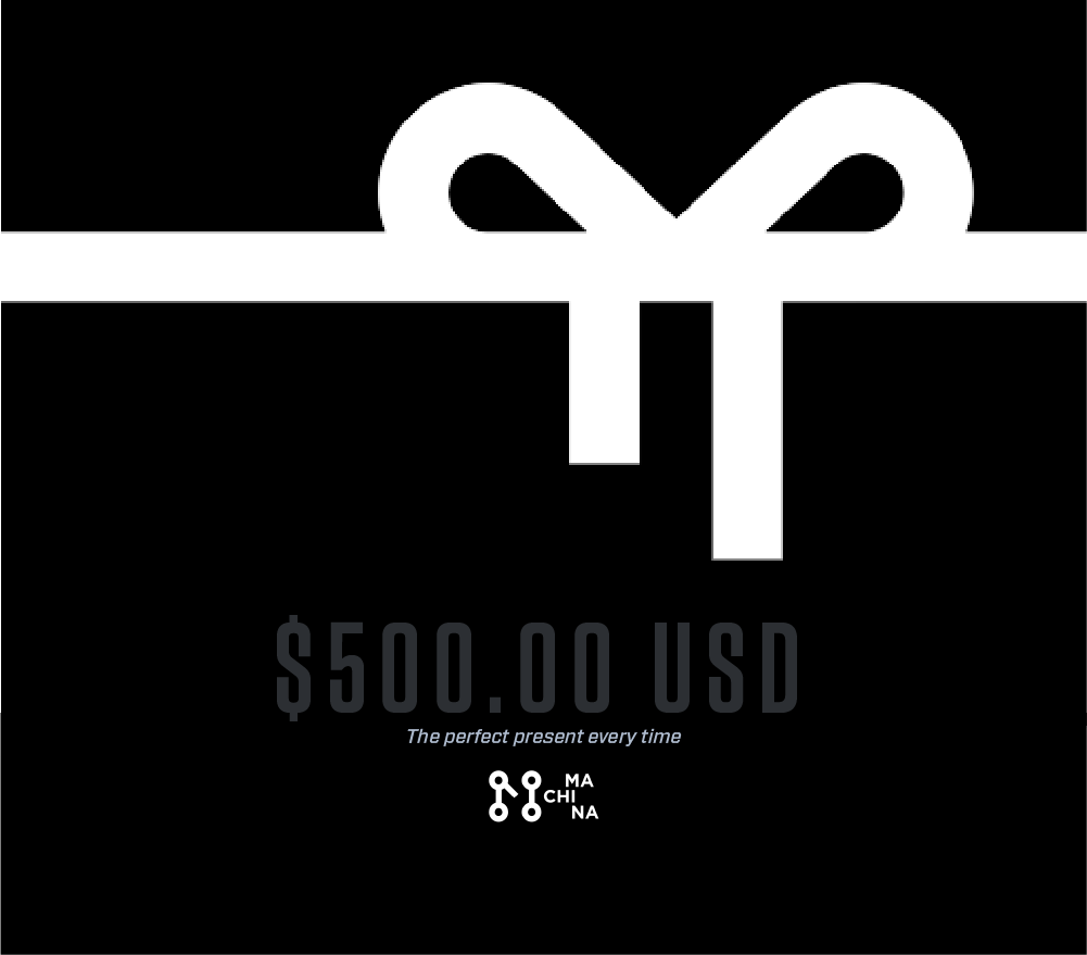 A Machina Gift Card featuring a sleek black design with a white bow and the text $500.00 USD underneath. Below the amount, the phrase "The perfect present every time" is displayed, positioning it as an ideal gift for indulging in stylish clothing. A small Machina Wearable Technology logo in the bottom right corner adds to its sophisticated appeal.